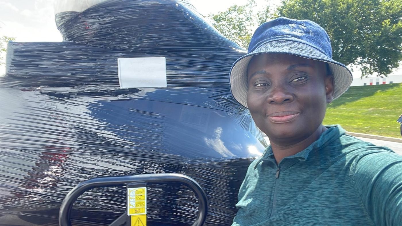 One of our team with a consignment wrapped for transit